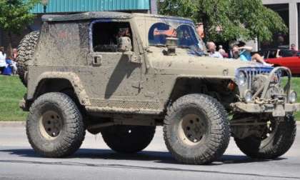 A mud coated Jeep Wrangler