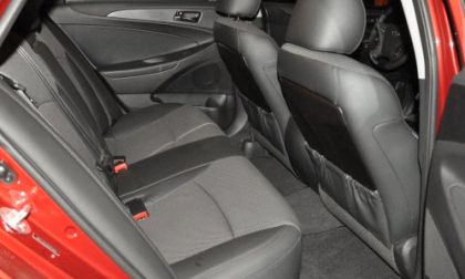 The rear seating area of the 2012 Hyundai Sonata SE, shown in black.