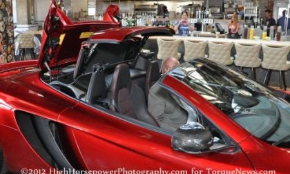 The 2013 McLaren 12C Spider with the top going up