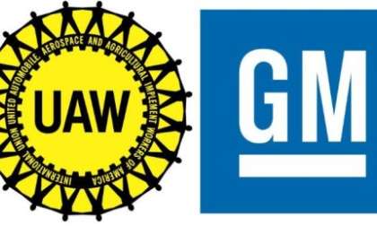 The logos of the UAW and General Motors