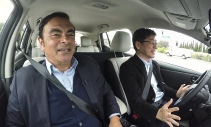 Carlos Ghosn (left) being driven in an autonomous car