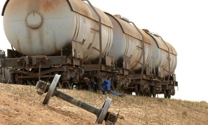 Derailed Iraqi rail cars, 2010. Wikimedia image is public domain. 
