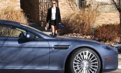 Katie MacKenzie approaching the 2011 Aston Martin Rapide Image © 2013 Don Bain