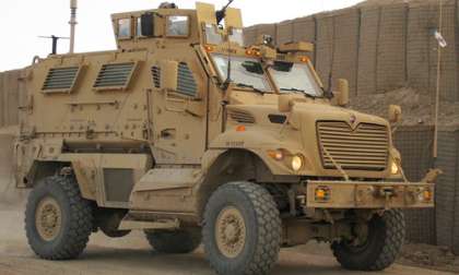  Shows the MRAP Driving. High-resolution image of the MaxxPro Dash model.