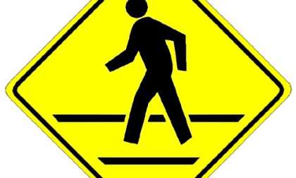 A pedestrican crossing sign indicates one place where TRW's system could help. 