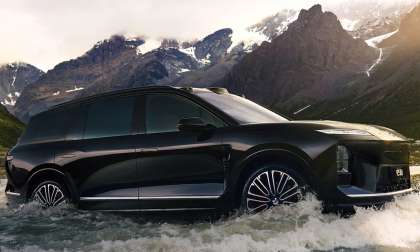 Nio ES8 driving through a mountain stream