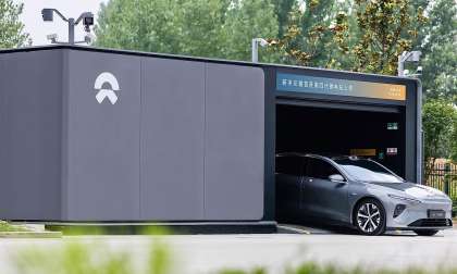Grey NIO car inside a battery swap station