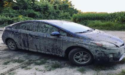 2013 Toyota Prius driving in the mud