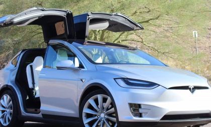 2020 white color Tesla Model X EV SUV with opened Falcon Doors