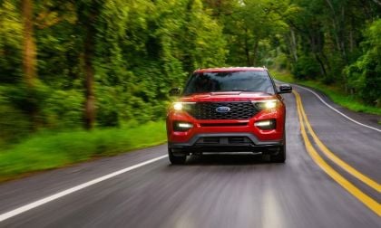  Ford Explorer cruising down road in daylight
