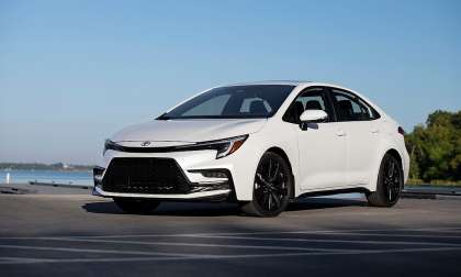 White 2023 Toyota Corolla XSE parked near the waterfront, shown from the front three-quarter angle.