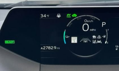Digital instrument cluster of Gilbert's Toyota Prius showing EV mode, 34°F temperature, 2,783 miles, and various driving assistance icons.