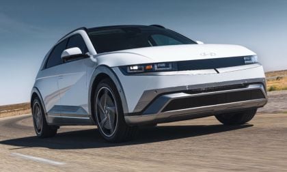 White 2025 Hyundai Ioniq 5 electric SUV turning on a desert road with angular, futuristic design