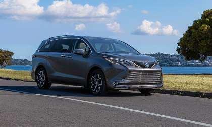 Gray 2025 Toyota Sienna Platinum parked near the waterfront in a front three-quarter view.