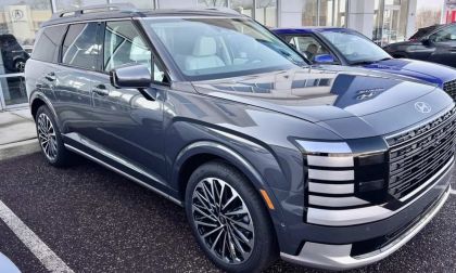 2026 Hyundai Palisade Hybrid Calligraphy SUV parked at dealership, showing bold front grille, premium wheels, and upscale exterior styling