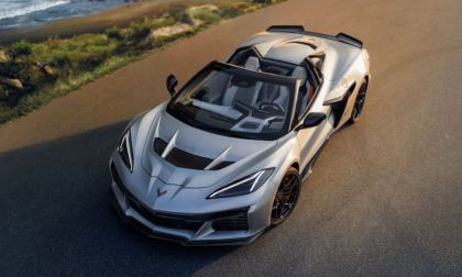 2026 Chevrolet Corvette C8 ZR1x in silver shown from a front three-quarter angle on a coastal road.