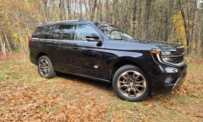 A 2026 Ford Expedition King ranch sits majestically in front of a fall foliage scene.