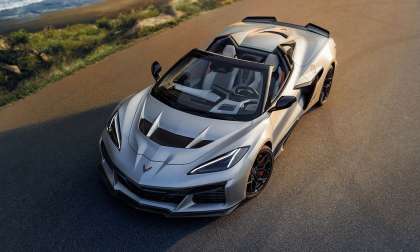 Front overhead view of a 2026 Chevrolet Corvette ZR1X Quail Silver convertible parked on a coastal road.