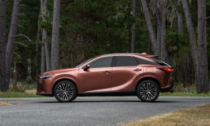 Copper 2026 Lexus RX on a forest road, full side profile