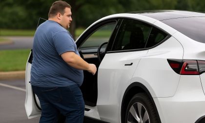 300-pound man getting into an electric vehicle