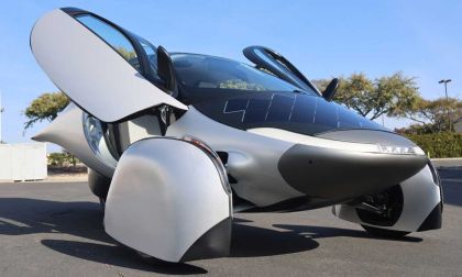 Image of the front of the Aptera, showcasing it's Lambo style doors, and solar panels on nose