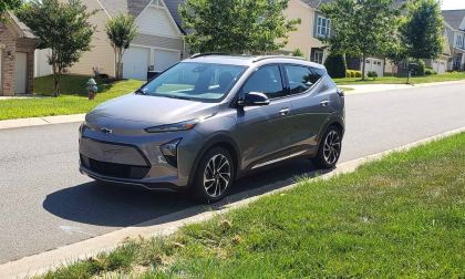 Gray Chevy Bolt parked on a residential street