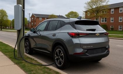 Chevy Equinox EV being charged by power pole mounted charger