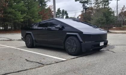 A Tesla Cybertruck looks menacing in a dark black glossy wrap