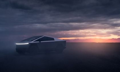 Tesla Cybertruck in desert with sunset and clouds