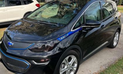 A black Chevy Bolt customized with blue trim