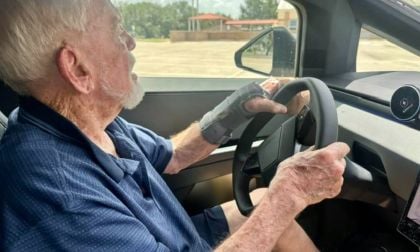 Dennis gripping the steering wheel, focused on the road ahead in Tesla Cybertruck