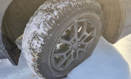 A Yokohama Geolandar tire is shown conquering snow