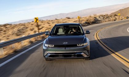 Hyundai Ioniq 5 electric SUV front three quarter view driving on desert highway