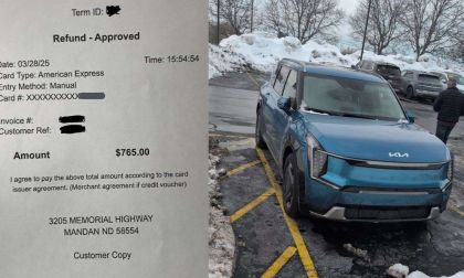 Blue Kia EV9 Service Bulletin with paper