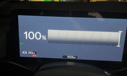 Marielle's Honda Prologue dashboard shows a full 100% charge, indicating a driving range of 283 miles. The odometer reads 1023 miles, with "Park" displayed.