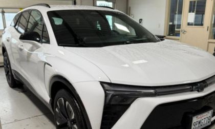 Nicholas' Mom's white 2024 Chevy Blazer EV shown from a front three-quarter angle in what appears to be a garage setting.