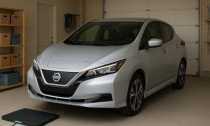 Nissan LEAF pulling over a wireless charger in a residential garage