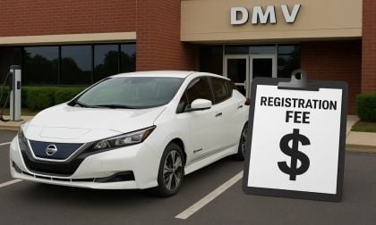 White Nissan LEAF in front of DMV office