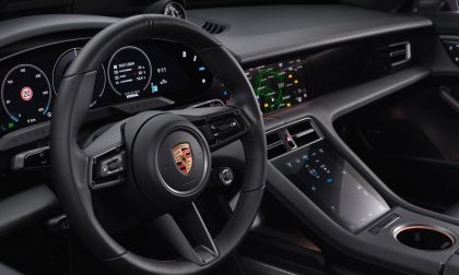 Interior of a Porsche Cayenne showing dashboard with touch screens