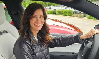 Shannon sitting in her new and white Tesla Model Y Performance