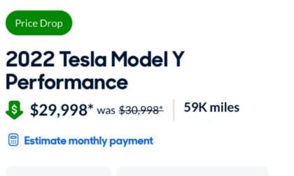 Advertisement for a 2022 Tesla Model Y Performance with a price drop to $29,998 from $30,998. The vehicle has 59K miles.