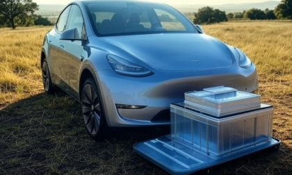 Tesla Model Y and a battery in front of it