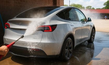 Silver Tesla Model 3 at a self-serve carwash