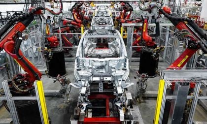 Tesla car on assembly line showing gigacasting