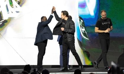 Tesla launch event showing Elon Musk on stage