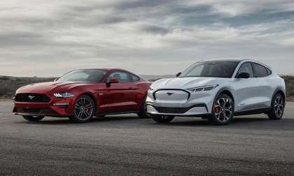 A regular Ford Mustang and an EV Mustang Mach-E parked side by side.
