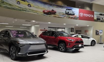 Image of Toyota plug-in vehicles on sale at a car dealership by John Goreham
