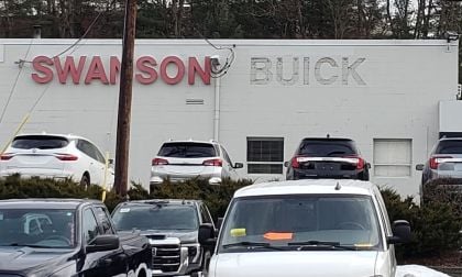 A Buick sign is removed from a Metro Boston dealership.