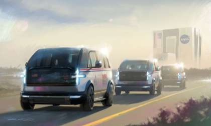 Image showing an artist's impression of three Canoo LVs transporting astronauts to the Kennedy Space Center launch pad.