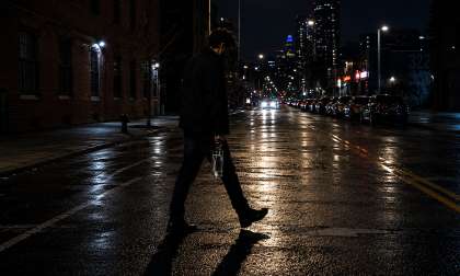 A generated image shows a man walking at night